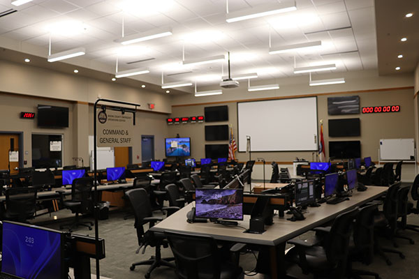 Teenagers walking toward fire and EMS vehicles